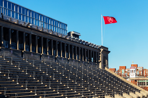 Boston, Massachusetts, USA - December 14, 2022: View of Harvard Stadium spectator seats and a red \