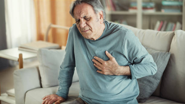 An elderly man with heart problems An elderly man with heart problems male chest pain stock pictures, royalty-free photos & images