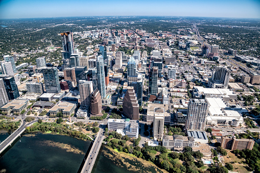 Aerial view of the buildings along the banks of the Colorado River in downtown Austin, Texas from about 2000 feet in altitude during a helicopter photo flight.