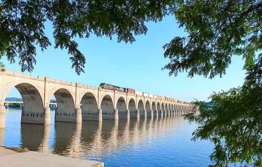 A train crossing the river on a bridge in downtown Harrisburg, Pennsylvania