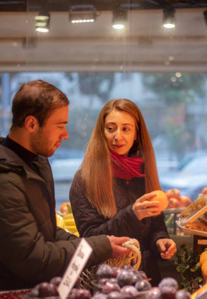 istock Young couple while shopping at the local grocery 1450122571