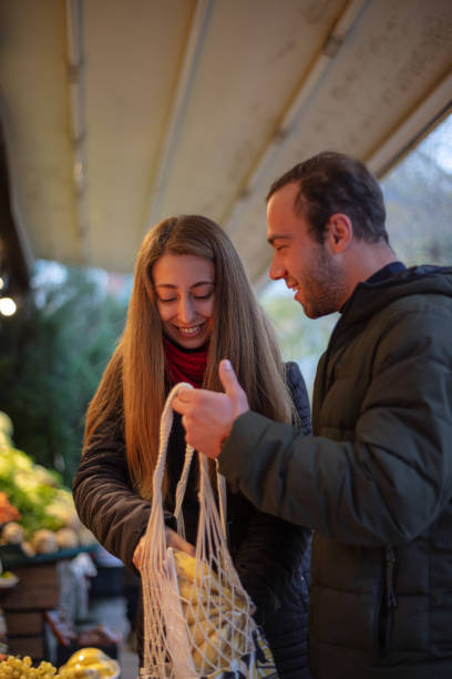 istock Young couple while shopping at the local grocery 1450122617