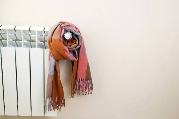 istock The radiator is wrapped in a multicolored warm scarf. 1450122861