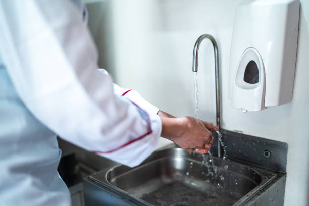 istock Chef washing hands in a commercial kitchen 1450126810
