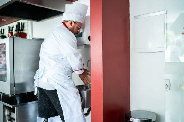 istock Disabled chef washing hands in a commercial kitchen 1450126823