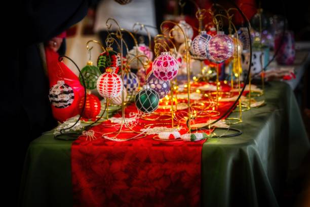 istock Closeup of Christmas decorations on a table with lights 1450127140