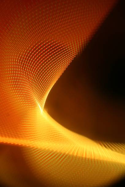 A vertical abstract illustration of a neon glowing reticulate wave, in yellow and orange, with light trails on a dark background