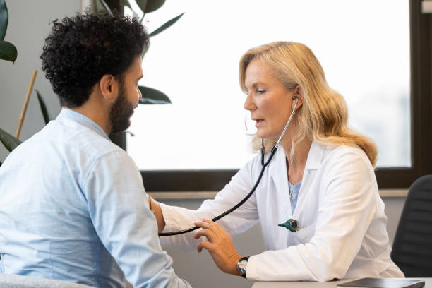 istock Doctor checking a middle-eastern man's breathing and heartbeat 1450132226