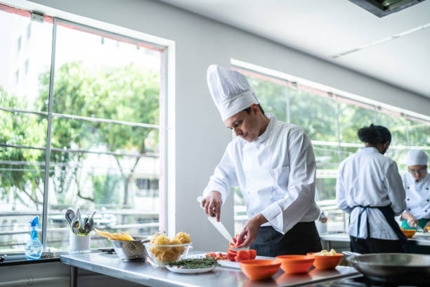 istock Chef cooking in a commercial kitchen 1450132410