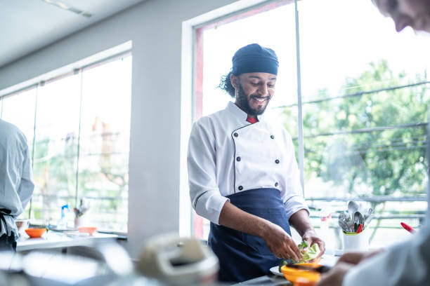 istock Chef cooking in a commercial kitchen 1450132428