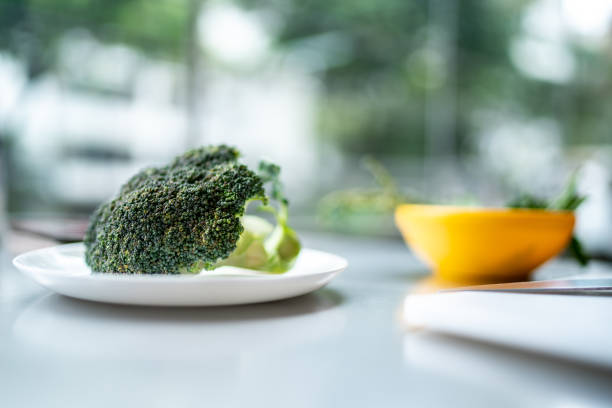 Raw broccoli in a plate in a commercial kitchen