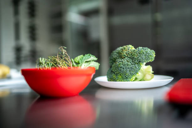 Raw broccoli in a plate in a commercial kitchen