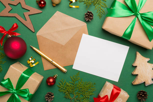 istock Craft envelope with christmas decoration on color background, top view 1450136750