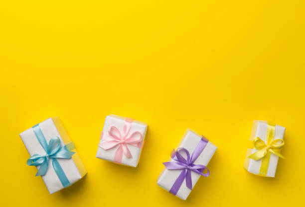 istock Colorful gift boxes on color background, top view 1450143359