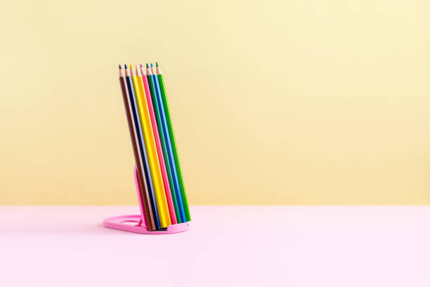 istock Creative education concept. Pencils on pink yellow background. 1450148000