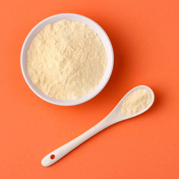 istock Powdered milk with nutrients in the bowl and spoon 1450149300