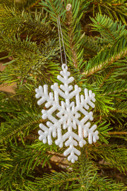 istock White snow star in Christmas tree 1450150678