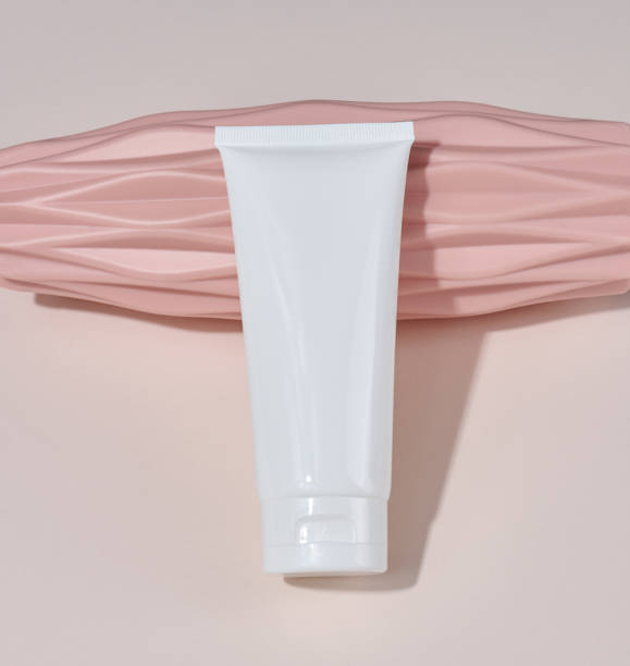 istock White plastic tube for liquid cosmetics on a beige background, packaging 1450156857
