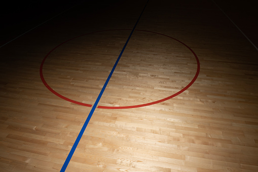 Wooden floor basketball, badminton, futsal, handball, volleyball, football, soccer court. Wooden floor of sports hall with marking lines on wooden floor indoor, gym court