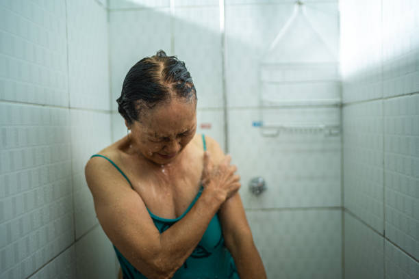 Senior woman taking a shower after swimming class