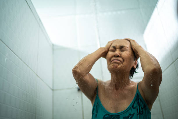 Senior woman taking a shower after swimming class