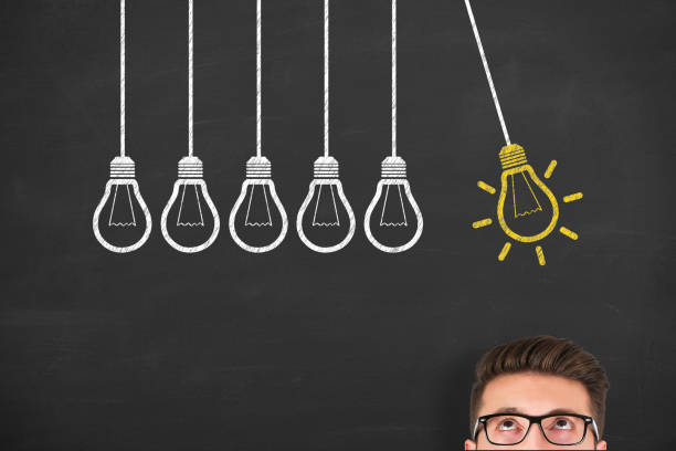 istock New idea concepts with light bulbs over human head on a chalkboard background 1450177270