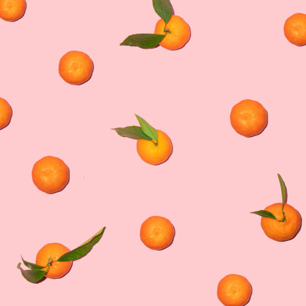 istock Tangerine pattern on pastel light pink background. Minimalistic fruit concept. Creative summer nature composition. 1450178423
