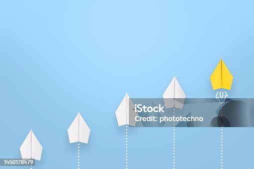 istock Change concepts with yellow paper airplane leading among white on blue background 1450178479