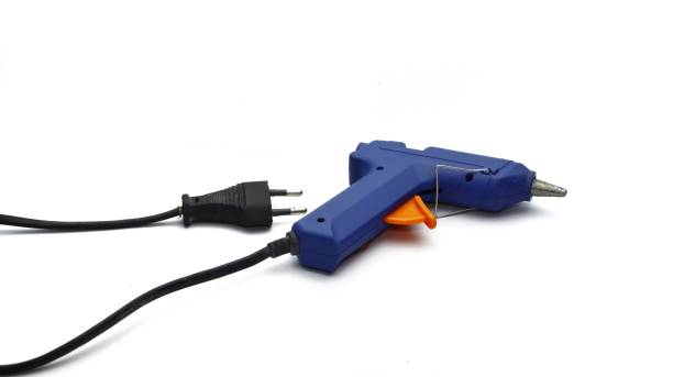 istock Electric hot glue gun isolated on white background. 1450181470