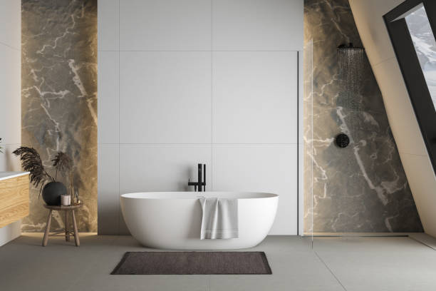istock Modern bathroom interior with concrete floor, white oval bathtub and white basin, shower, plant and snowy mountain view from windows. Minimalist bathroom with modern furniture. 3D rendering 1450182606