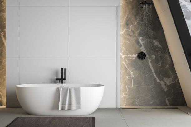 istock Modern bathroom interior with concrete floor, white oval bathtub and white basin, shower, plant and snowy mountain view from windows. Minimalist bathroom with modern furniture. 3D rendering 1450183871