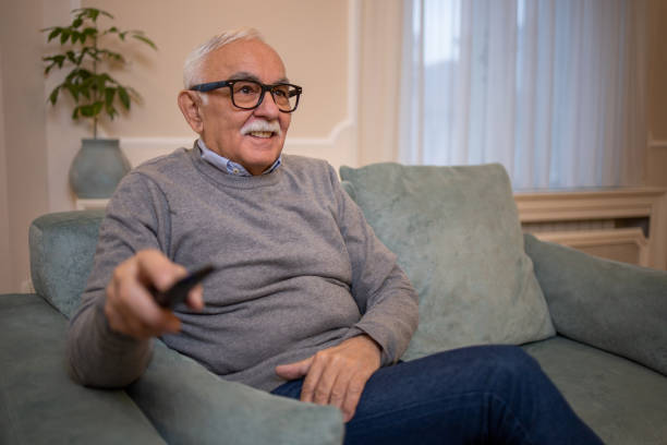 istock Man watching TV in the room 1450184400