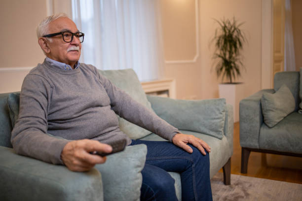 istock Man watching TV in the room 1450184401