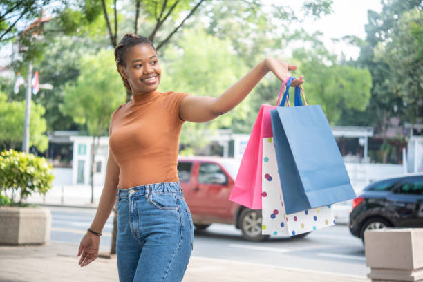 istock Young woman coming back from shopping 1450191555