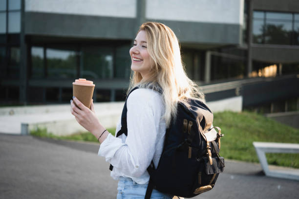 istock Portrait of a happy student enjoying coffee 1450191737