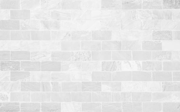 istock White grunge brick wall texture background for stone tile block painted in grey light color wallpaper modern interior and exterior and room backdrop design. Simple seamless pattern grid for backdrop. 1450192163