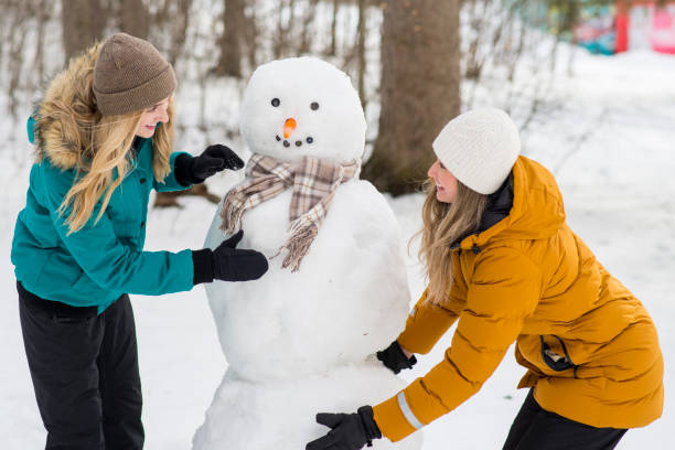 istock Friends Building a Snowman 1450193170
