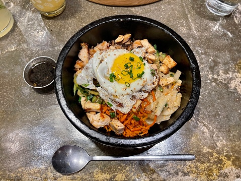 Dolsot Bibimbap is Bibimbap served in a sizzling hot stone bowl. The bottom layer of rice is crispy so it adds a nice texture and flavor.