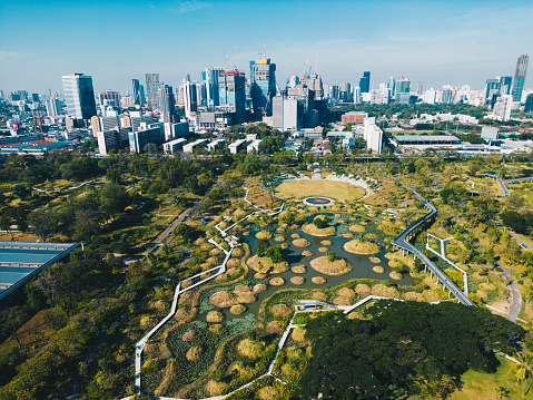Aerial view city green forest public park with modern office building Benjakitti Park Bangkok Thailand
