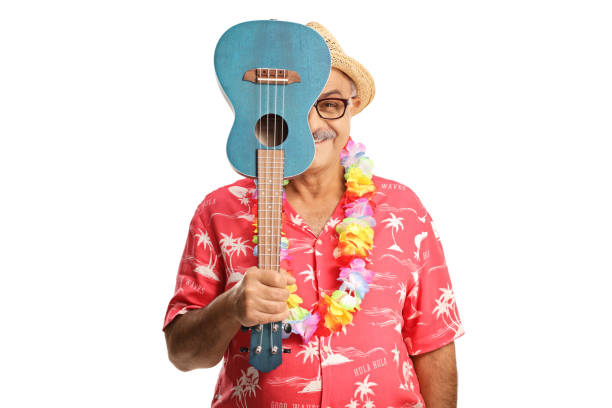 istock Smiling man hiding behind ukulele instrument 1450205659