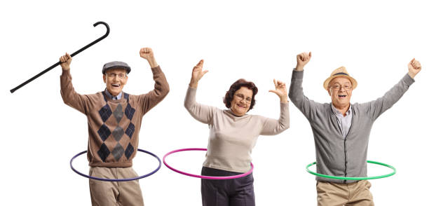 istock Happy senior people spinning hula hoops 1450205661