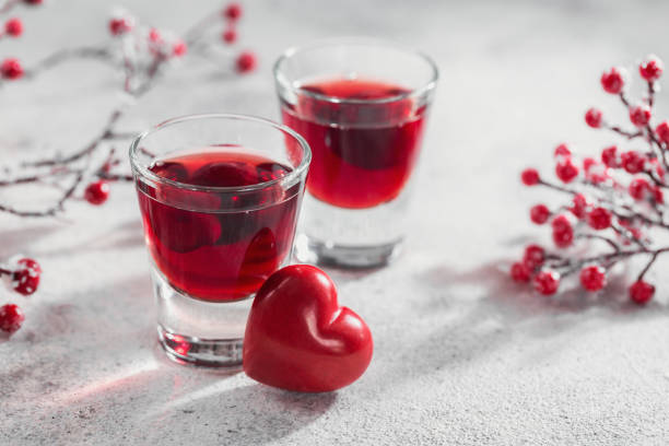 istock Red cocktail, vodka or liqueur and Heart shape decorations 1450206122