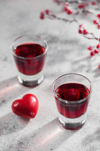 istock Red cocktail, vodka or liqueur and Heart shape decorations 1450206125