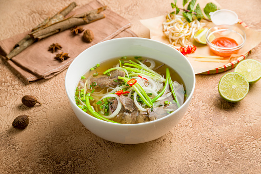 Soup Pho Bo with beef, onion and noodles
