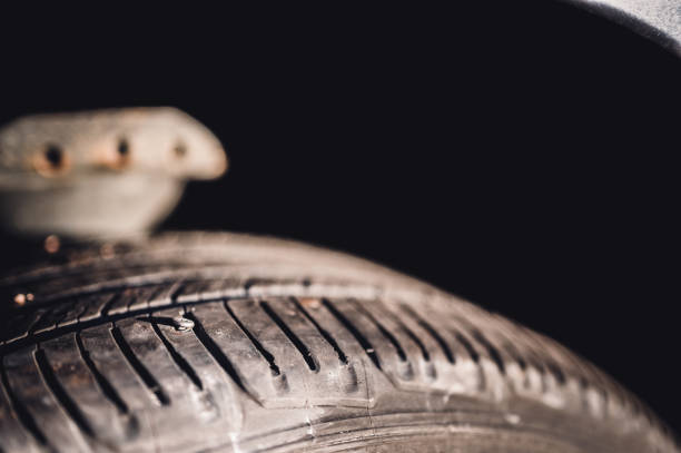 istock screw protruding from the tread of a tire causing a flat. 1450207243