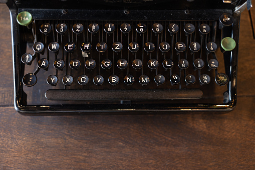 vintage typewriter keys with selective focus. Antique Typewriter. Vintage Typewriter Machine Closeup Photo.