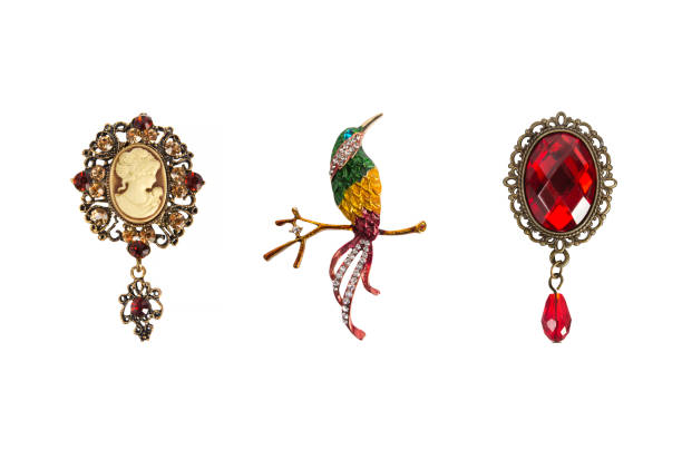 Jewelry set of 3 colorful vintage brooches - cameo, bird and victorian brooches, fashion accessories, isolated photo.