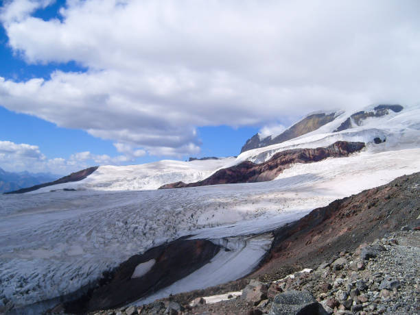 istock Glacier in the mountains with clouds 1450219381