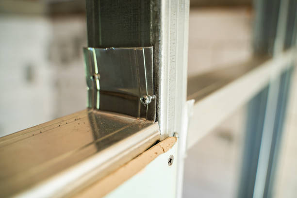 istock Incorrect and poor-quality connection of a metal profile in a frame plasterboard partition. Assembling a partition in a room using self-tapping screws 1450225978