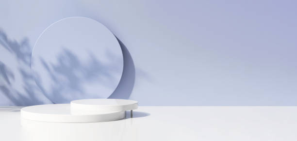 istock Two layer white glossy round podium on table counter in dappled sunlight with tropical tree branch leaf shadow on pastel purple blue wall background 1450228798